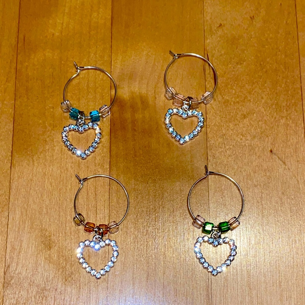 Beautiful rhinestones heart and glass bead wine charms. Set of 4.